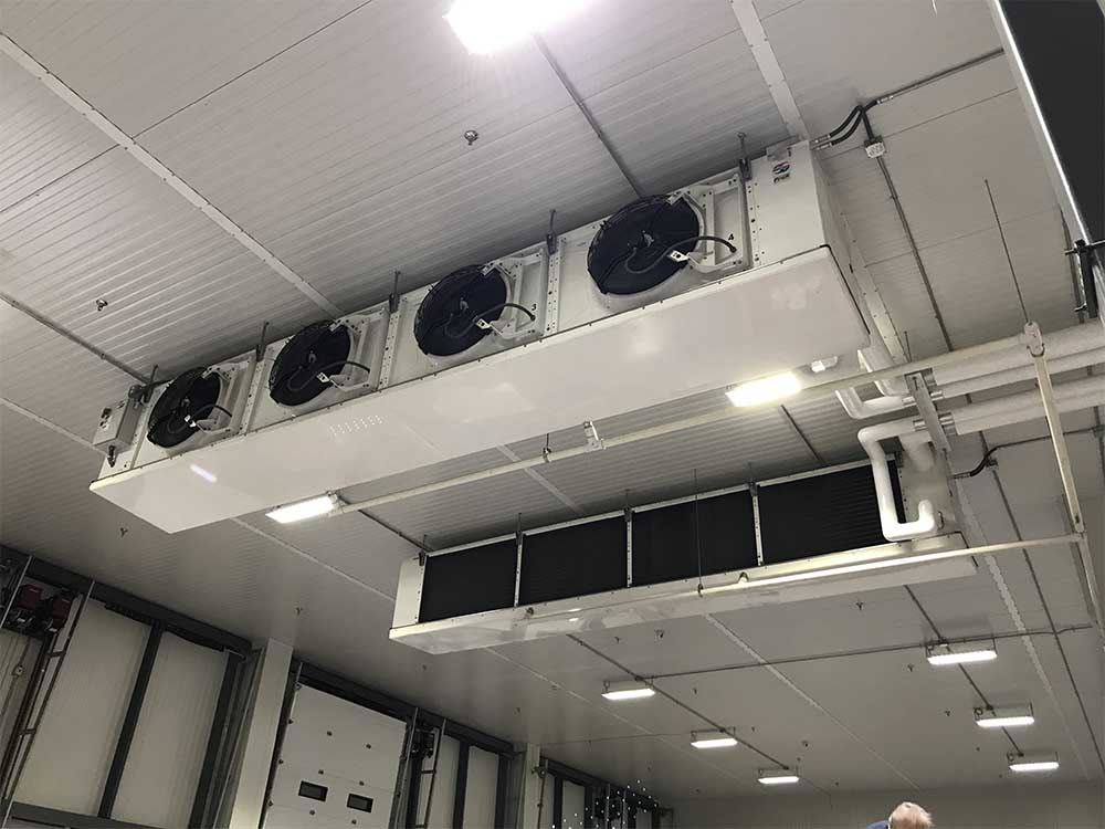 Refrigeration cooling unit on ceiling of warehouse