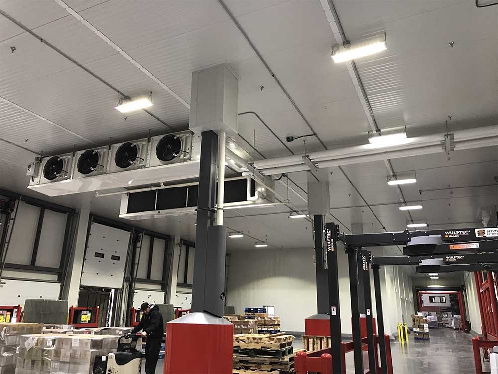 Refrigeration unit on ceiling of warehouse